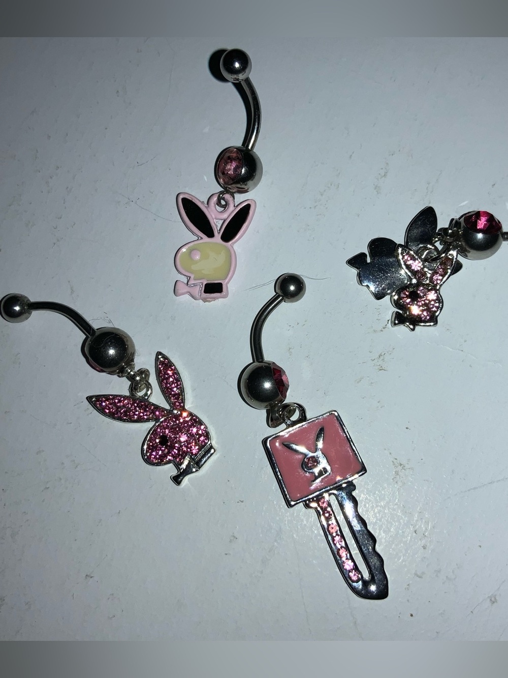 Playboy Y2K belly rings pink